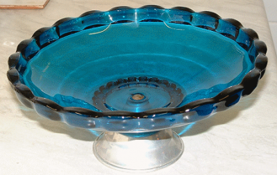 Sowerby 2725 Tyneside teal compote on aluminium stand
Sowerby Tyneside 2725 midnight blue compote on aluminium stand

ID courtesy of vanmann25 on eBay who was selling a labelled version of the same bowl in June 2010

See also catalogue image on 20th Century Glass https://www.20thcenturyglass.com/glass_encyclopedia/glass_catalogues/sowerbyglass_catalogues/sowerbyglass_catalogue_list41-06.htm
Keywords: pressed