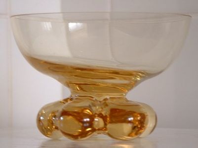 Unknown amber footed, clear bowl sundae dish
One of a set of 8, hand-made with small unfinished pontil underneath. Unknown maker.
