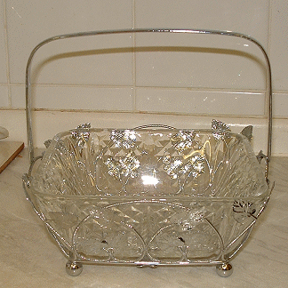 Unknown square glass dish in chrome holder with leaf pattern
Unknown maker 
Keywords: pressed