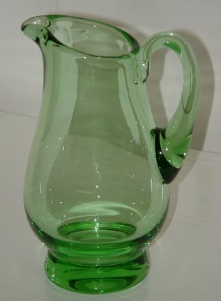 Unknown green creamer - side view
Unknown maker. Polished pontil. 5" tall, base = 2" diameter
It has been suggested this could be part of the Wealdstone range (Whitefriars/Wuidart).
Keywords: mouldblown