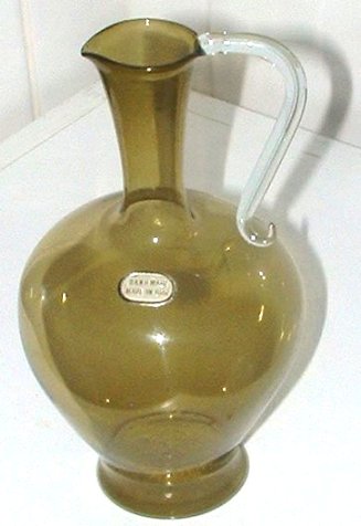 GDR Jug
Very thin, light-weight jug, with sticker saying Hand Made in the GDR. Colour is olive oil green. Probably Lauscha.
Keywords: Germany