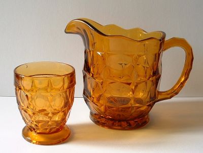 Sowerby 2481 jug in amber with 3 tumblers
Height: 5?" high, holds 1? pints. It is shown in the Sowerby 1956 catalogue.
Keywords: Sowerby pressed England
