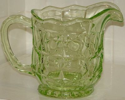 Sowerby 2481 jug in green
Height: 5?" high, holds 1? pints. It is shown in the Sowerby 1956 catalogue.
Keywords: Sowerby pressed England