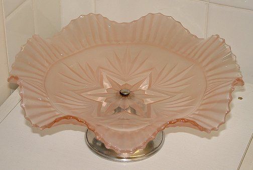 Sowerby pink satin cakestand - top view
With chrome stand. 104mm high 248 diameter
GMB topic: [url]http://www.glassmessages.com/index.php/topic,1419.0.html[/url] 
Keywords: Sowerby pressed England