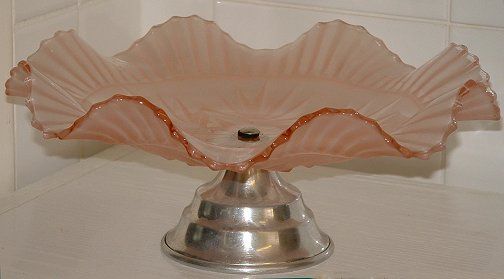 Sowerby pink satin cakestand - side view
With chrome stand. 104mm high 248 diameter
GMB topic: [url]http://www.glassmessages.com/index.php/topic,1419.0.html[/url] 
Keywords: Sowerby pressed England