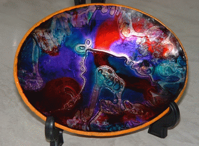 Pigskin glass plaque
I don't know who made this but I believe it is pigskin glass. This is a traditional Mexican craft according to the website about pigskin artist Manuel Silvia here:  [url]http://www.geocities.com/galleryartfx/manuelsilvia.html[/url]
Keywords: Pigskin