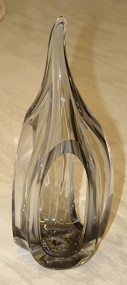 Unknown glass sculpture - View 2
Hand-made (rough pontil mark on the base), has three openings cut into the sides. 6.75" tall and base is 2.5" at the widest part
