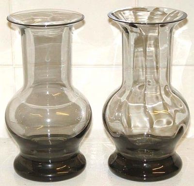 Wedgwood smokey vases
Left one unlabelled. Right one etched Wedgwood on the base.

FJT43 Ming Vase
FJT43/1 Height 110mm; FJT43/2 140mm;  FJT43/3 180mm
Made in clear and midnight and in plain or optic glass
Keywords: Wedgwood England